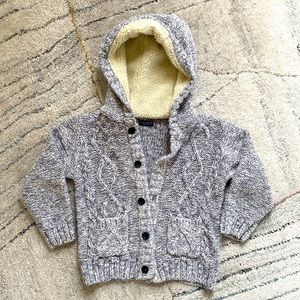 Gray marled cable cardigan sweater with shearling lined hood